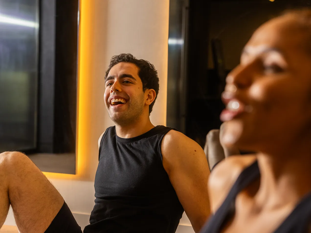 Two members laughing during a class.