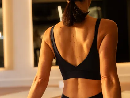 A member taking a break between yoga exercises.