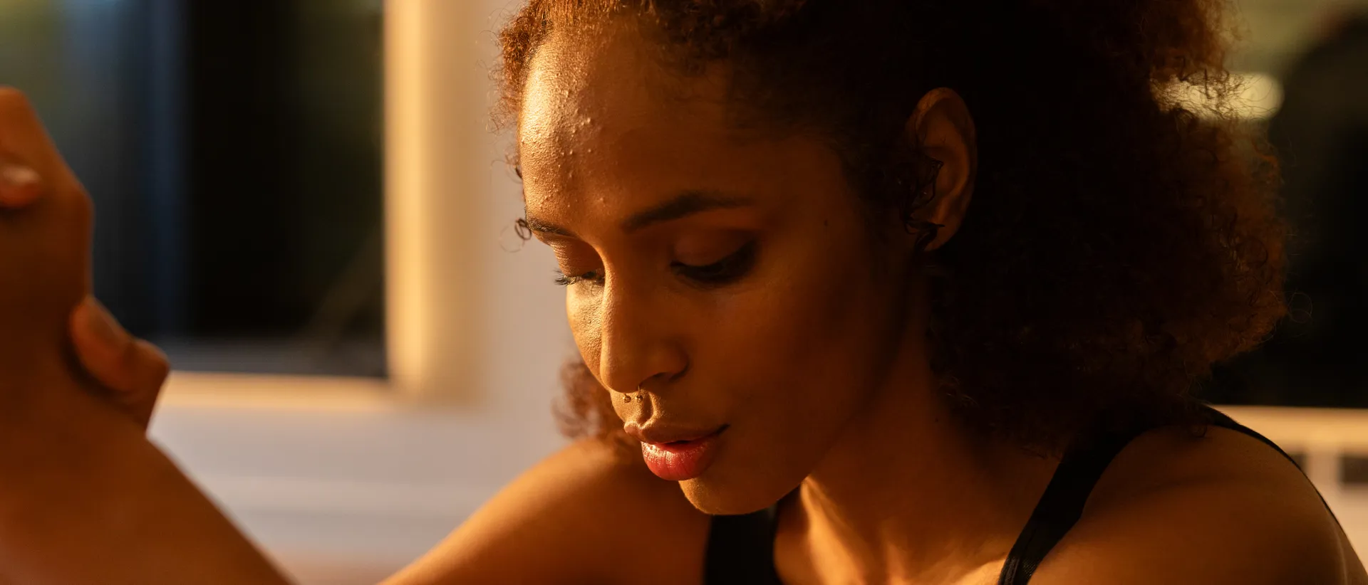 Female member performing breath work.