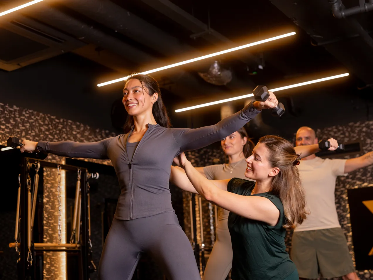three members and an instructor during a fitness class in the X Studio.